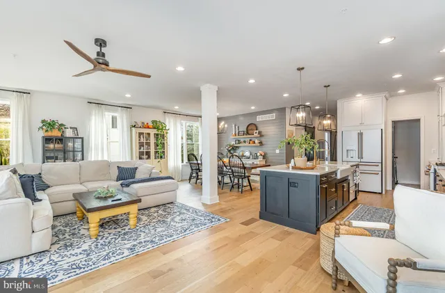 a spacious bathroom with a double vanity sink a mirror a and a window