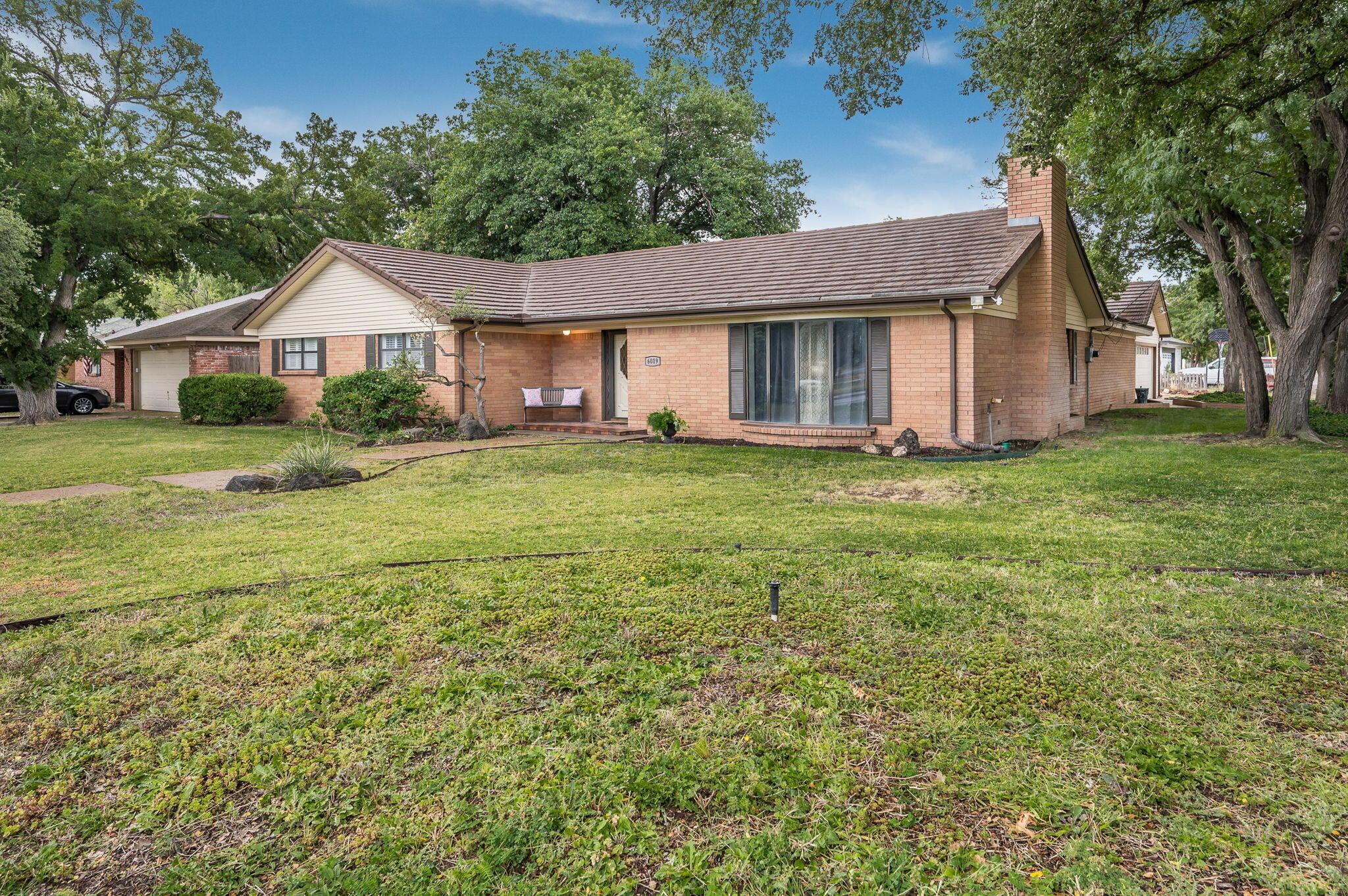 6019 Calumet Road Amarillo, TX 79106 - Photo 2 of 25 a front view of a house with a yard