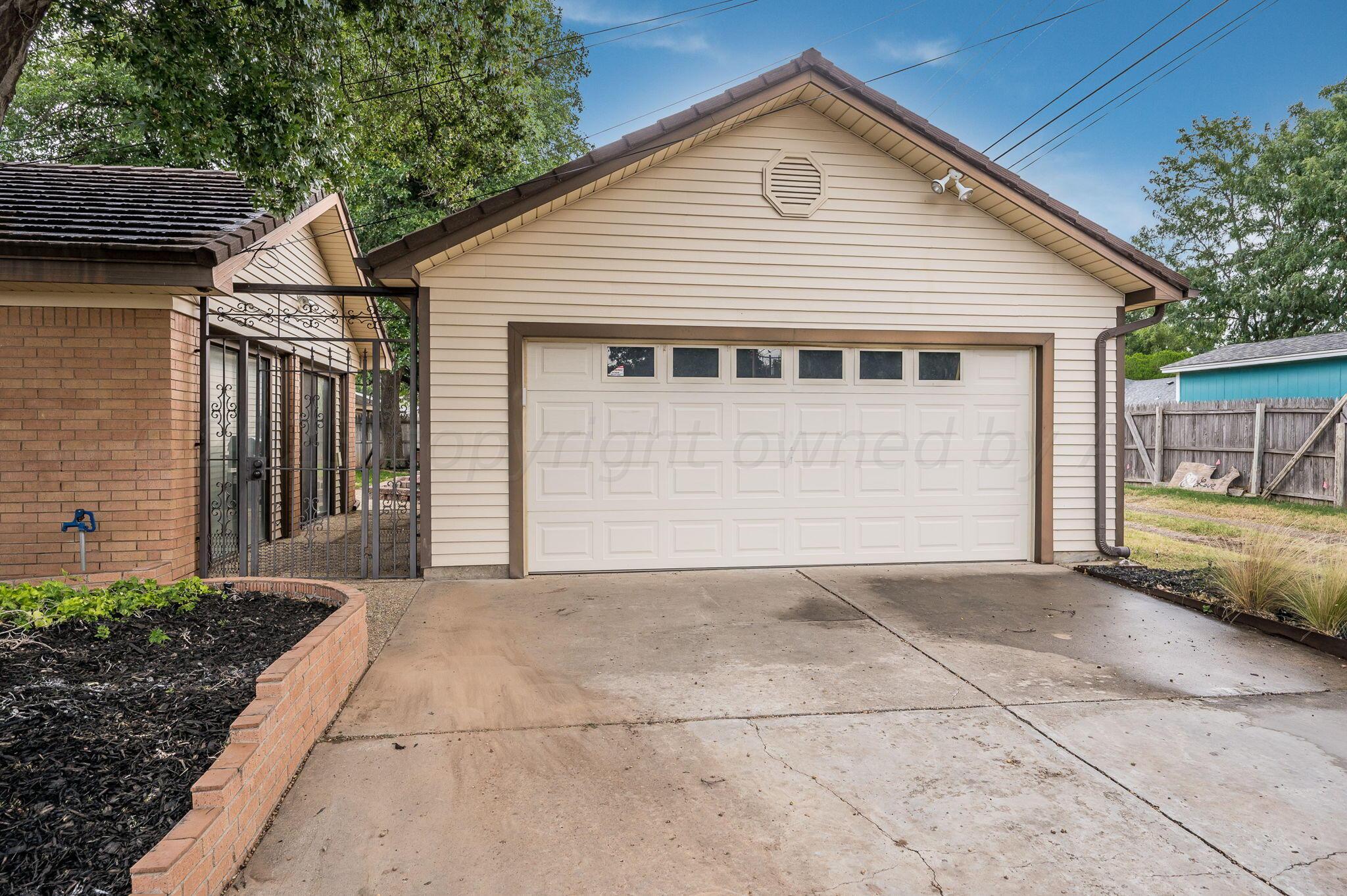 6019 Calumet Road Amarillo, TX 79106 - Photo 25 of 25 a front view of a house with a garage