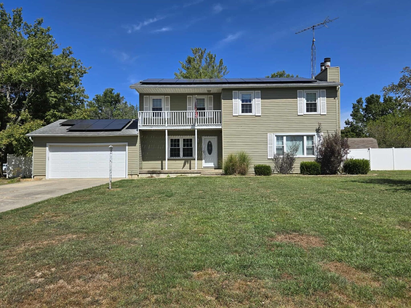 108 Mockingbird Lane Woodlawn, IL 62898 - Photo 3 of 43 a front view of a house with a garden