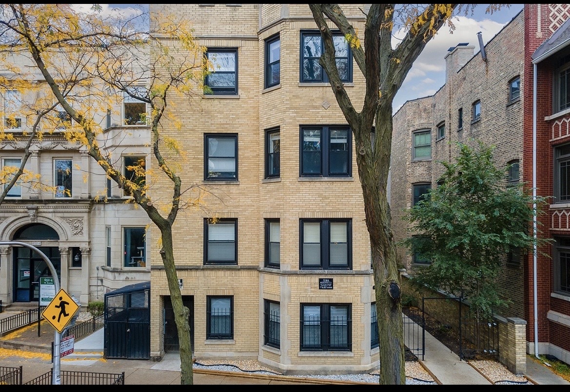 646 West Roscoe Street, Unit 1N Chicago, IL 60657 - Photo 1 of 11 a multi story building with glass windows