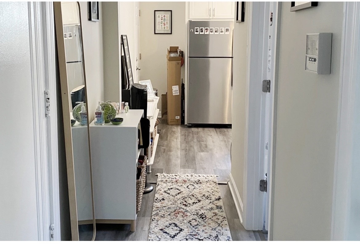 646 West Roscoe Street, Unit 1N Chicago, IL 60657 - Photo 7 of 11 a view of hallway with furniture and a refrigerator