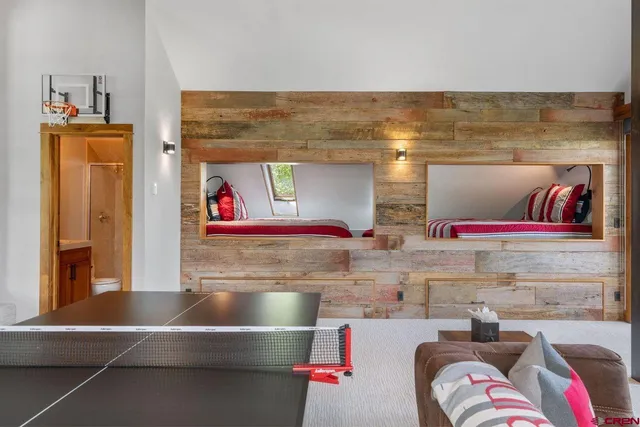 a bedroom with stainless steel appliances kitchen island granite countertop a sink and a stove