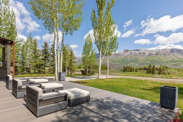 a front view of a house with garden and porch