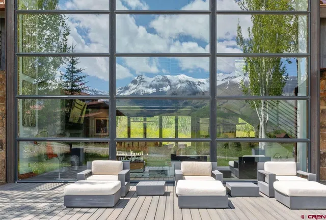 a patio with a table and chairs