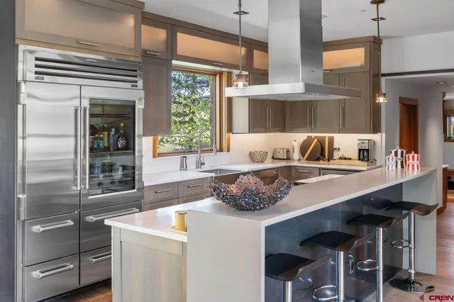 a kitchen with a sink cabinets and window