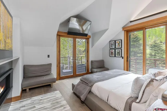 a bedroom with a bed and a couch