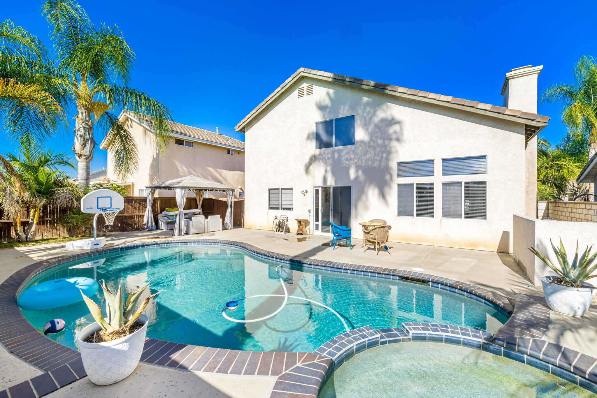 a view of a swimming pool with a patio