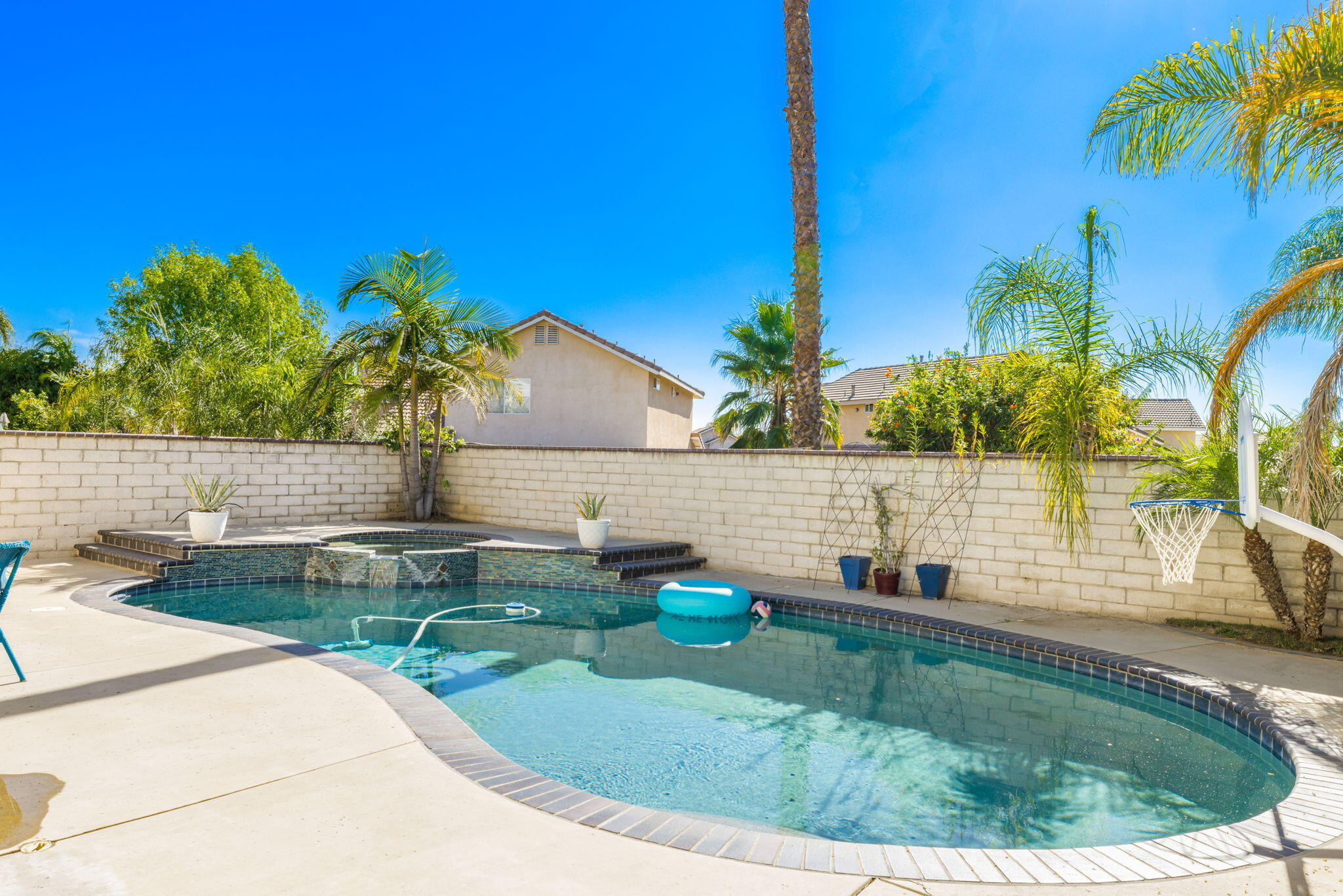 7607 Canberra Way Riverside, CA 92508 - Photo 16 of 28 a view of a swimming pool with a patio