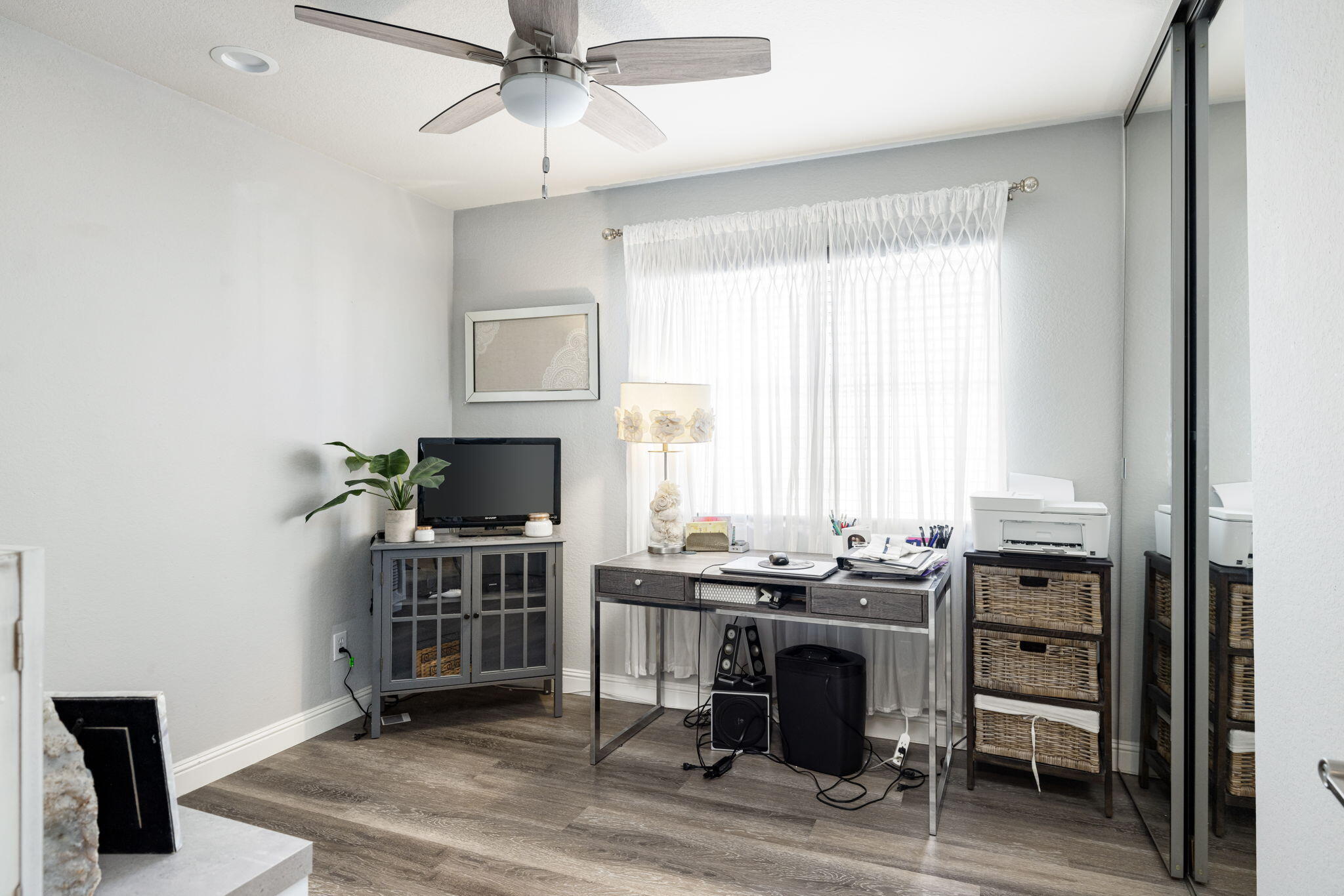 7607 Canberra Way Riverside, CA 92508 - Photo 20 of 28 a view of a workspace with furniture and a window