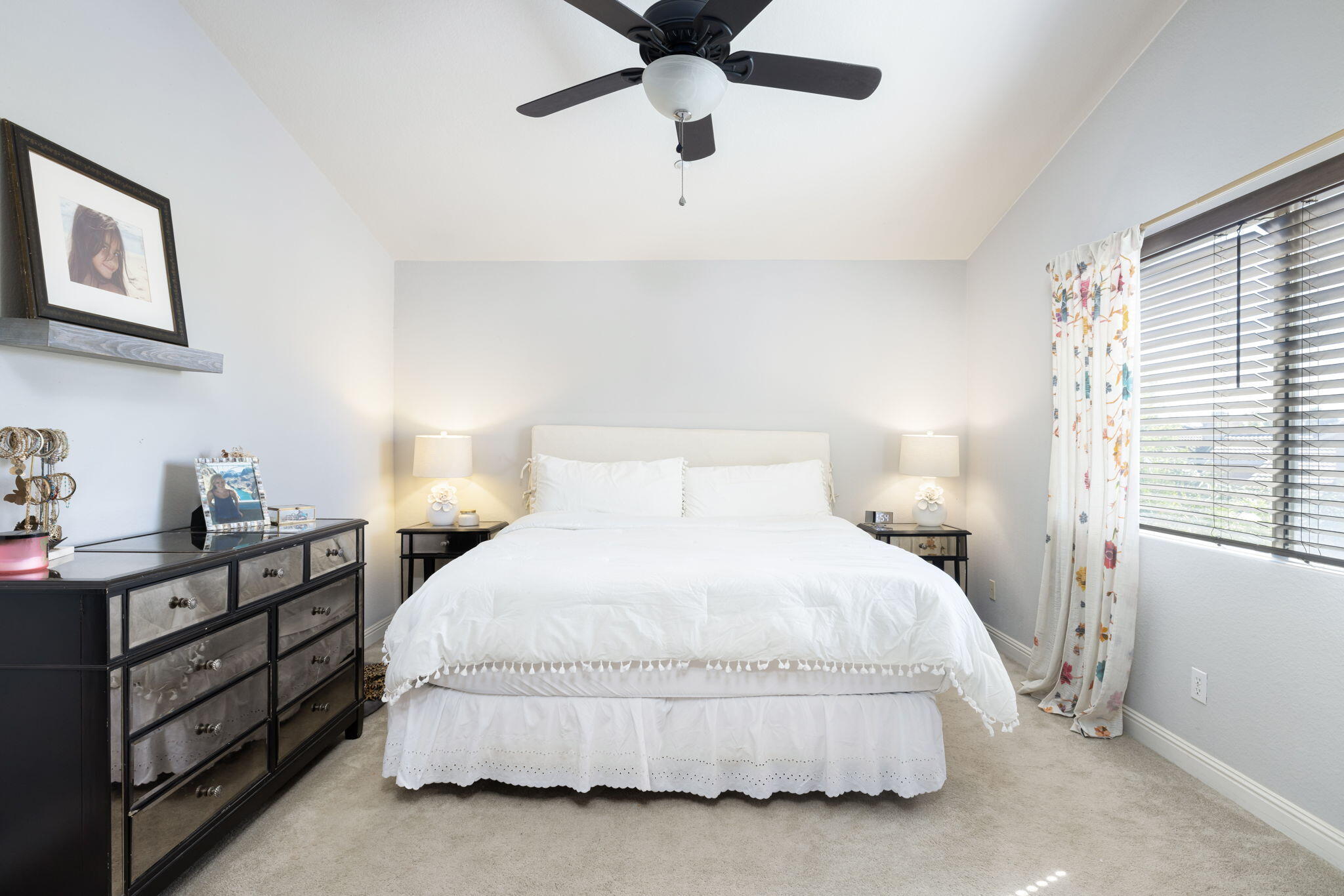 7607 Canberra Way Riverside, CA 92508 - Photo 22 of 28 a bedroom with a bed and window