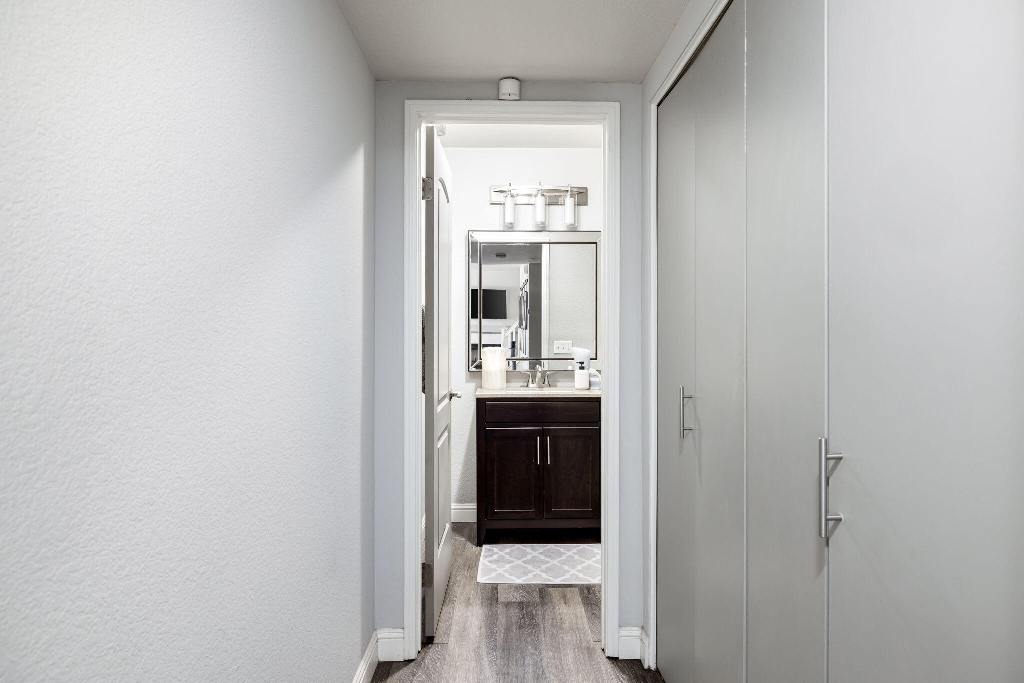 7607 Canberra Way Riverside, CA 92508 - Photo 27 of 28 a bathroom with a sink and a mirror
