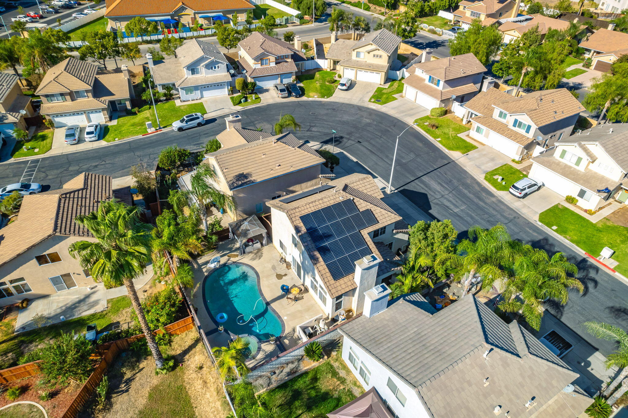 7607 Canberra Way Riverside, CA 92508 - Photo 8 of 28 an aerial view of a house with a swimming pool