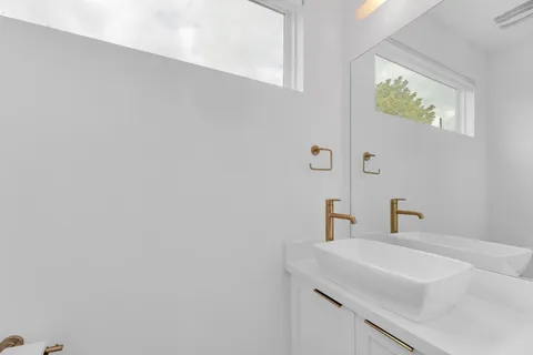 a table with a vase and a vase on it with table and chairs