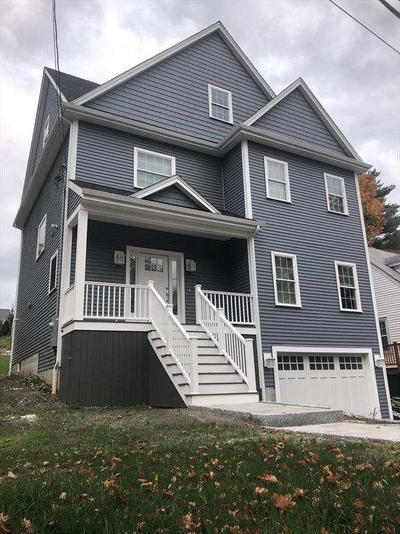 a front view of a house with a porch
