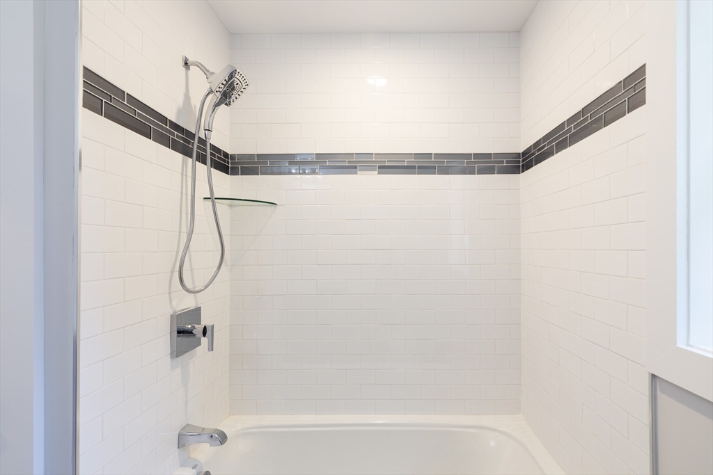 239 Hardy Pond Road Waltham, MA 02451 - Photo 15 of 28 a bathroom with a shower and a shower head