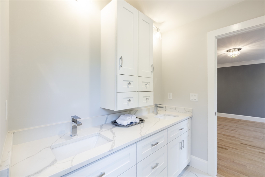 239 Hardy Pond Road Waltham, MA 02451 - Photo 16 of 28 a bathroom with a sink and a mirror