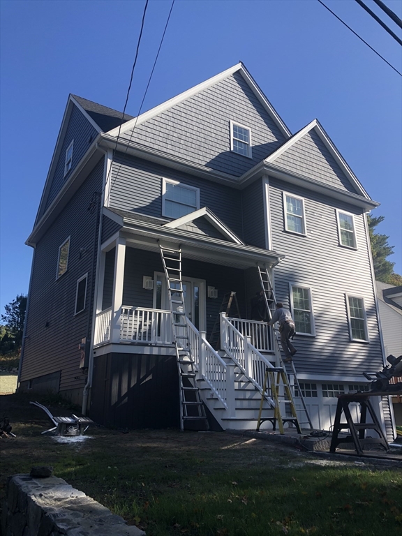 239 Hardy Pond Road Waltham, MA 02451 - Photo 28 of 28 a front view of a house with a yard