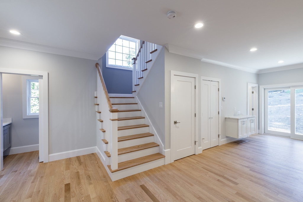 239 Hardy Pond Road Waltham, MA 02451 - Photo 10 of 28 wooden floor in an empty room with a window