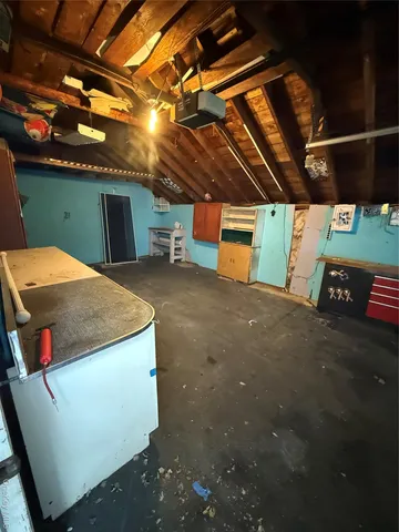 a view of an empty room with a garage
