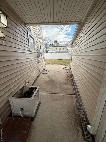 a view of a backyard with large trees