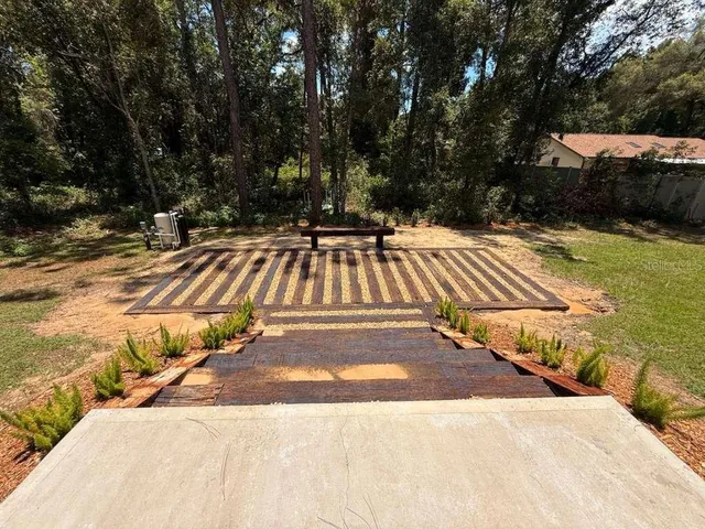 a view of swimming pool with seating space