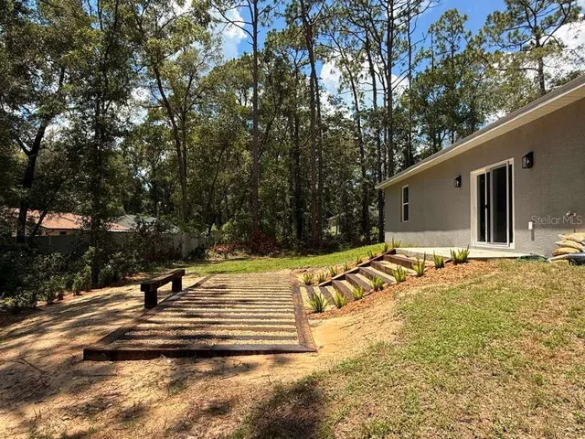a view of swimming pool with trees