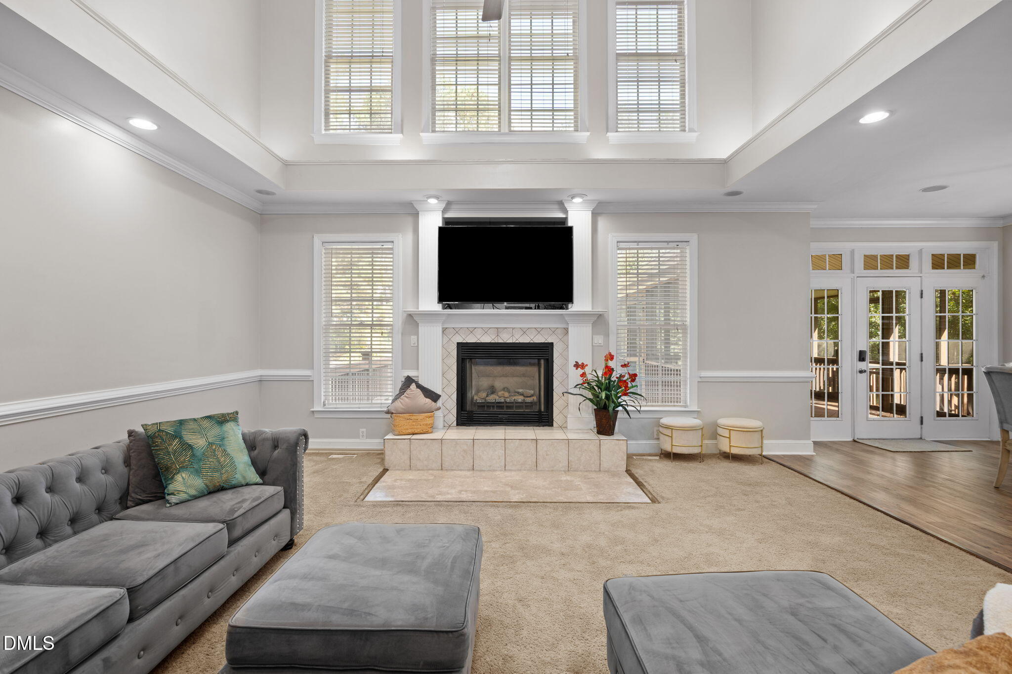 3689 Graham Sherron Road Wake Forest, NC 27587 - Photo 16 of 57 a living room with furniture a flat screen tv and a fireplace