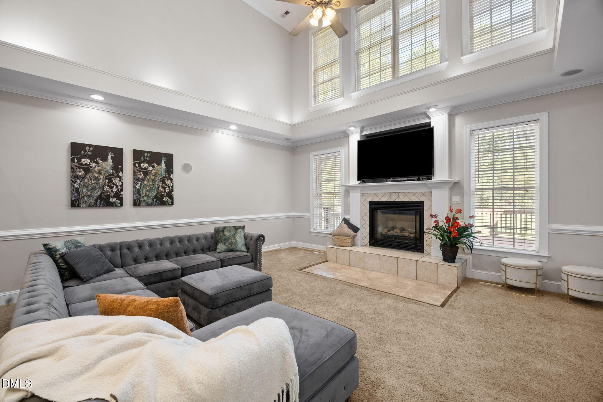 3689 Graham Sherron Road Wake Forest, NC 27587 - Photo 17 of 57 a living room with furniture a flat screen tv and a fireplace