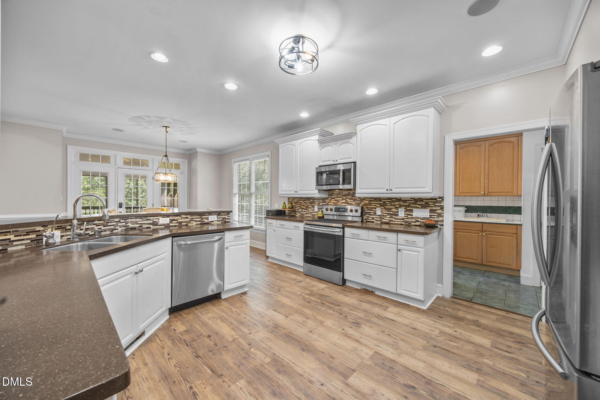 3689 Graham Sherron Road Wake Forest, NC 27587 - Photo 2 of 57 a kitchen with a refrigerator stove top oven and sink