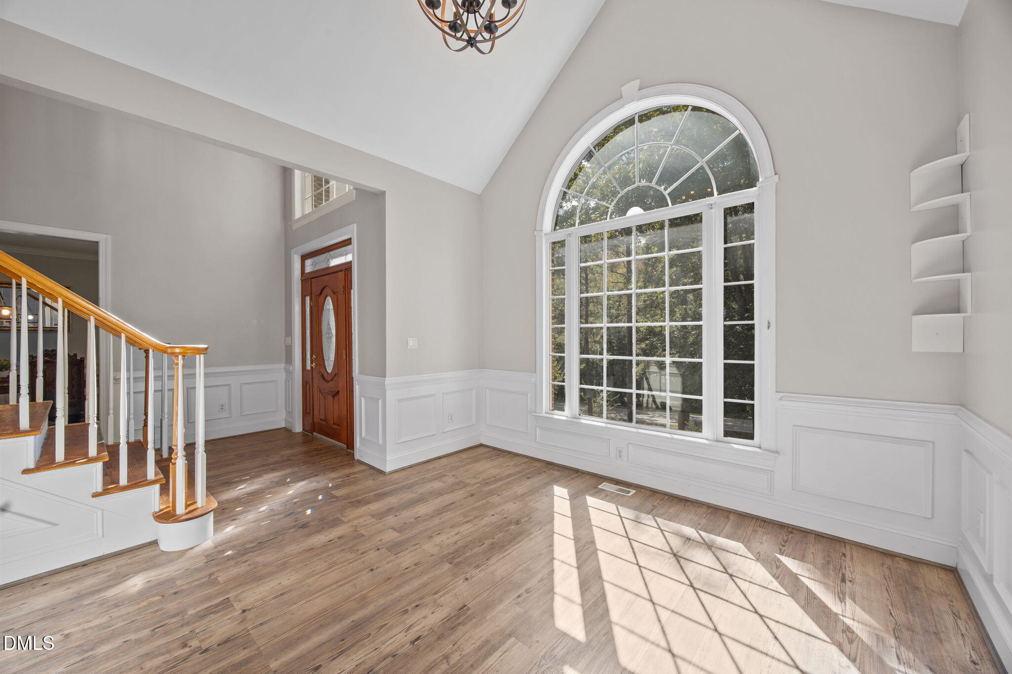 3689 Graham Sherron Road Wake Forest, NC 27587 - Photo 21 of 57 a view of an empty room with wooden floor and a window
