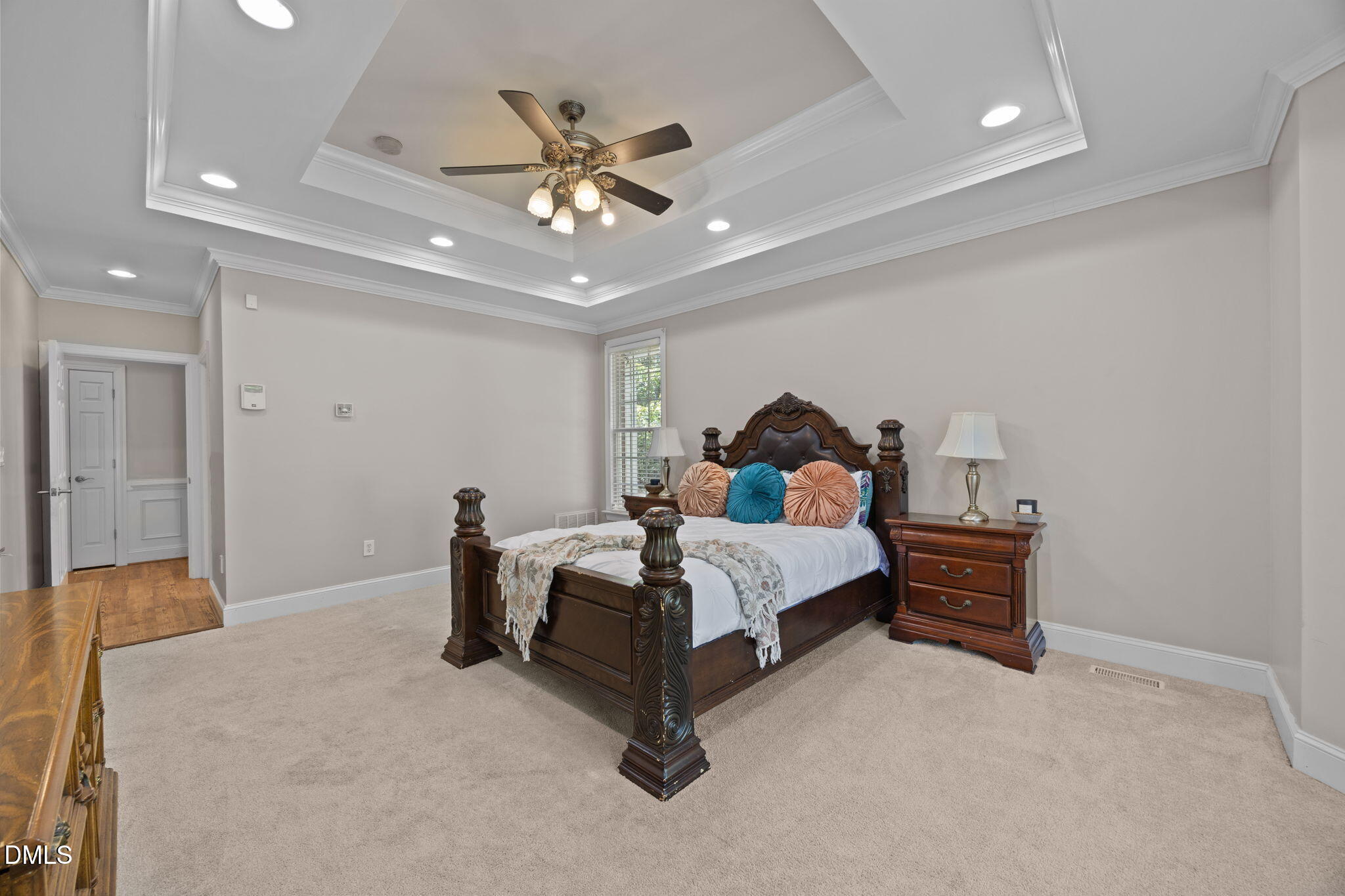 3689 Graham Sherron Road Wake Forest, NC 27587 - Photo 23 of 57 a bedroom with a bed and a chandelier