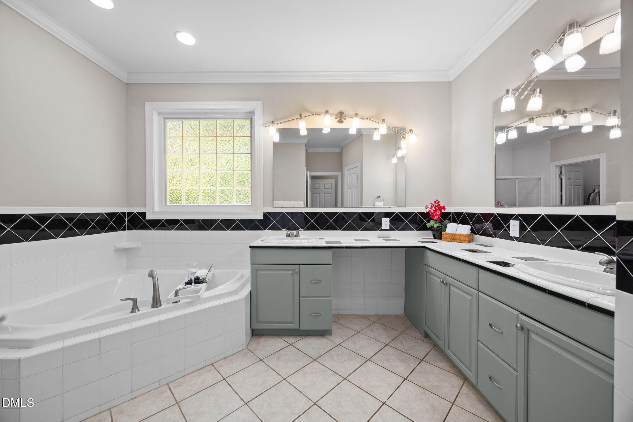 3689 Graham Sherron Road Wake Forest, NC 27587 - Photo 25 of 57 a bathroom with a granite countertop sink mirror and a bathtub