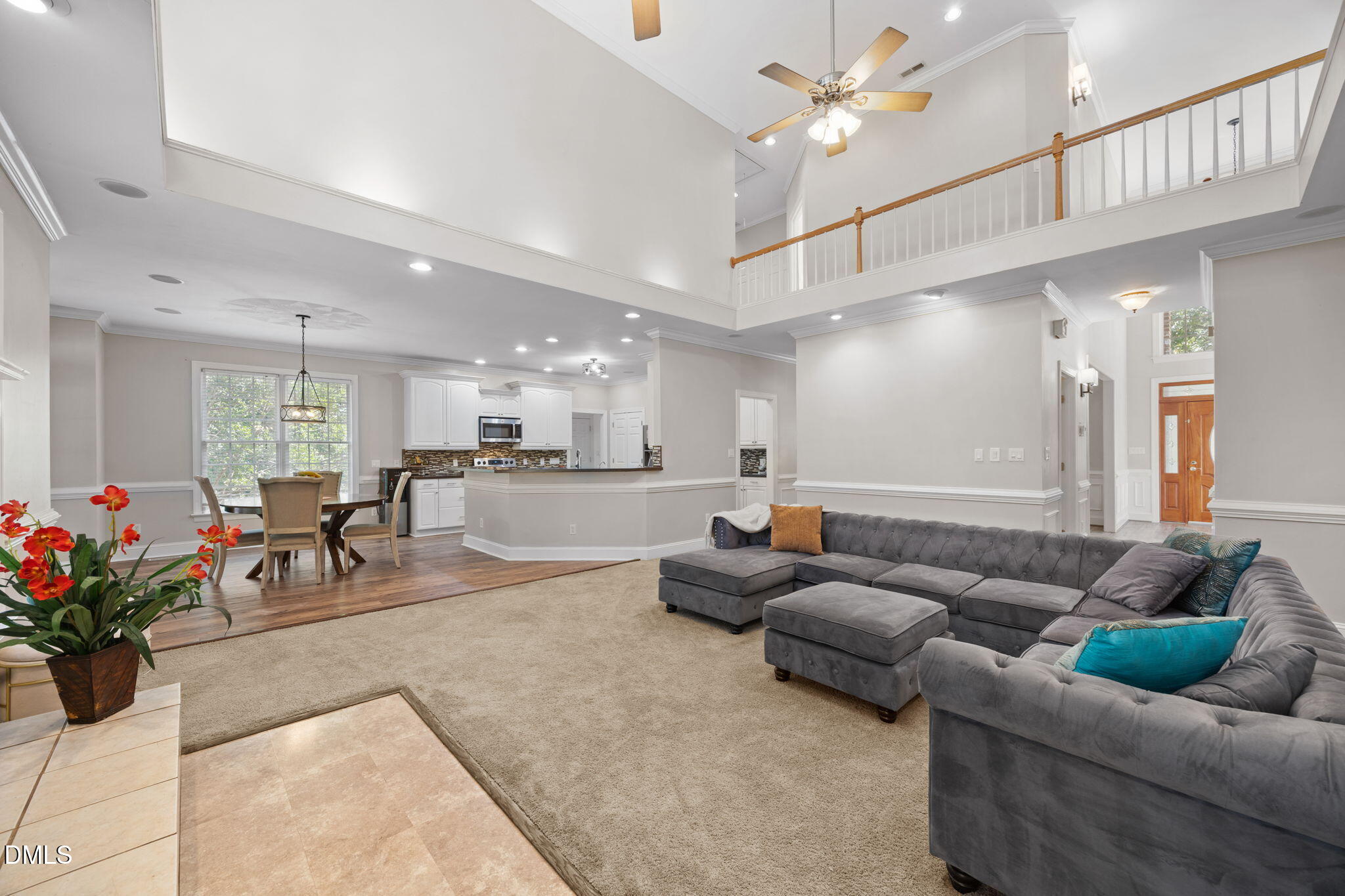 3689 Graham Sherron Road Wake Forest, NC 27587 - Photo 3 of 57 a living room with furniture and a potted plant
