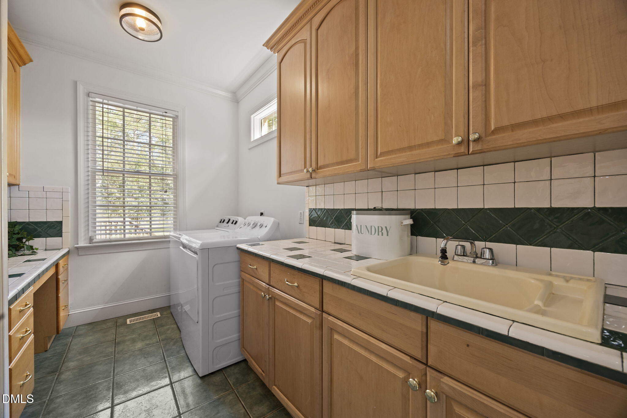 3689 Graham Sherron Road Wake Forest, NC 27587 - Photo 39 of 57 a kitchen with a sink cabinets and window