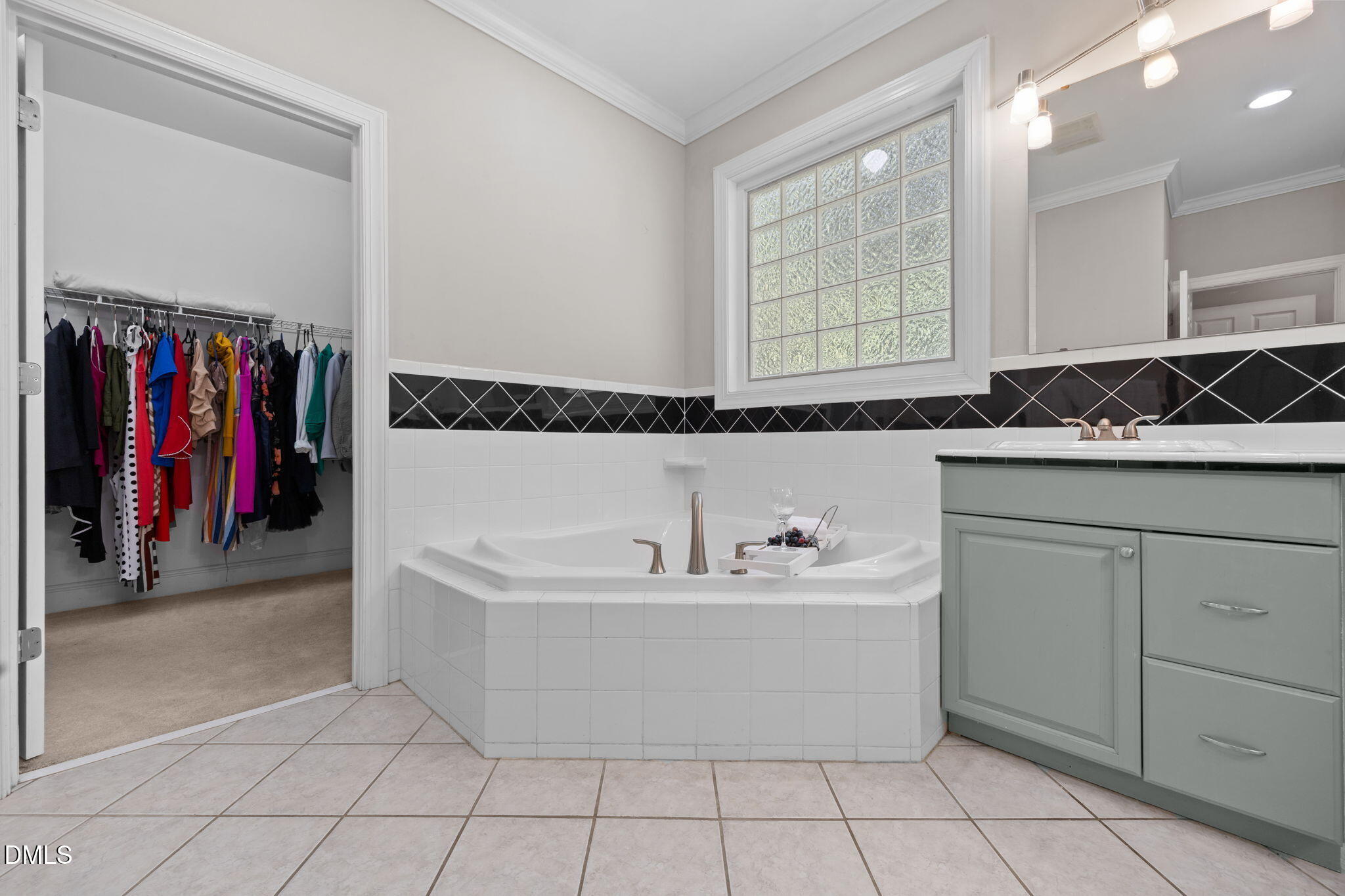 3689 Graham Sherron Road Wake Forest, NC 27587 - Photo 42 of 57 a bathroom with a tub sink and mirror