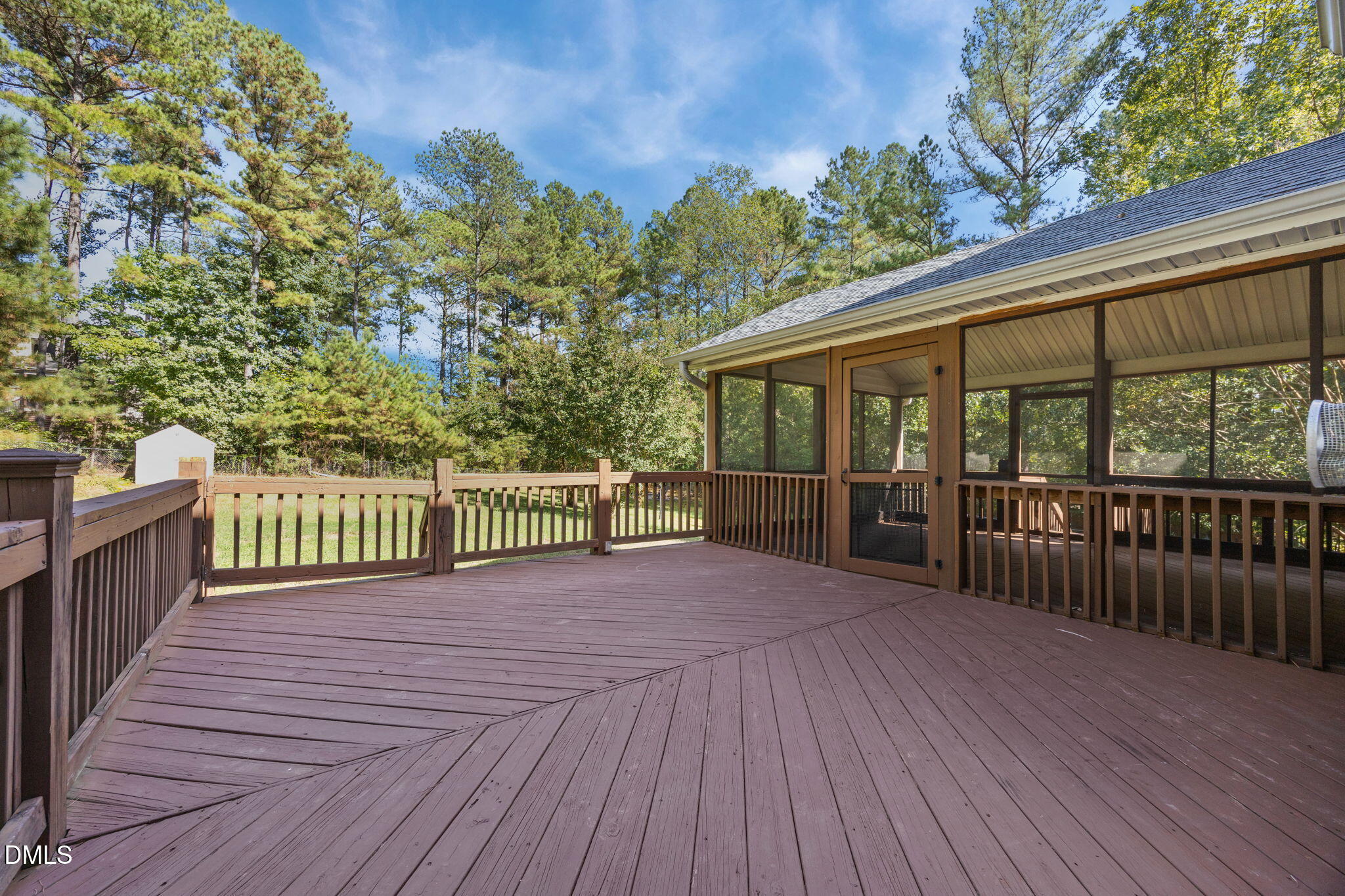 3689 Graham Sherron Road Wake Forest, NC 27587 - Photo 45 of 57 a view of a deck with wooden floor and fence with a large garden