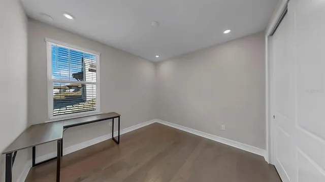 a view of a hallway with stairs