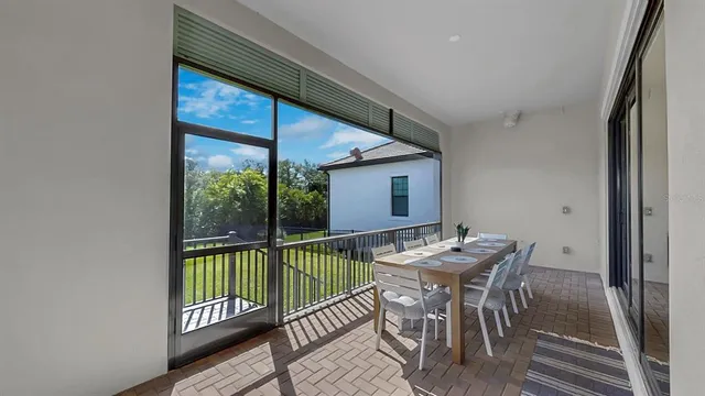 a view of a dining room with furniture window and outside view