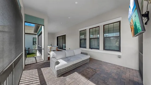 a view of a living room and a balcony