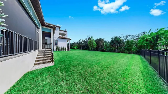 a front view of a house with a yard table and chairs