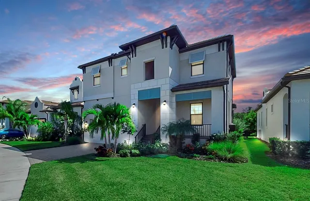 an aerial view of a house with a garden