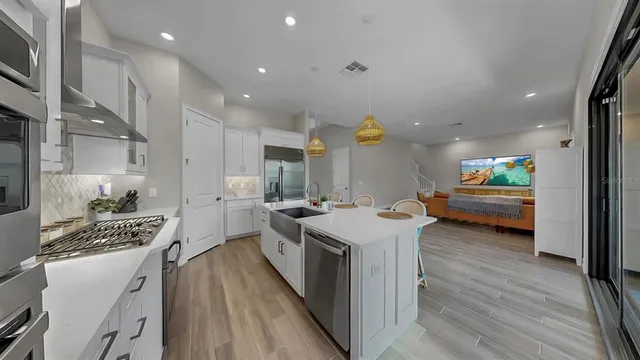 a kitchen with sink and stove