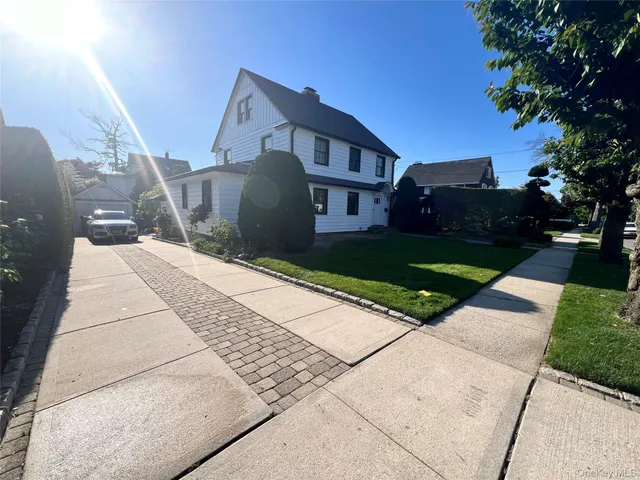 a front view of a house with yard