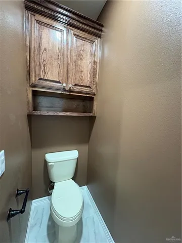 a bathroom with a toilet and a sink