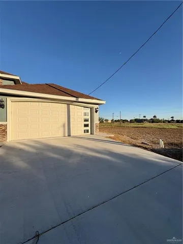 a view of an empty room with a ocean view