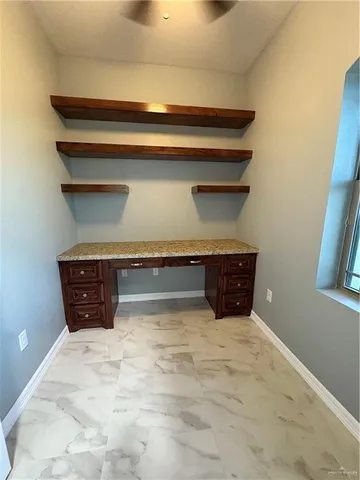 a view of an empty room with stairs