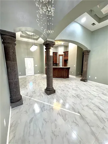 a view of a hallway with a chandelier