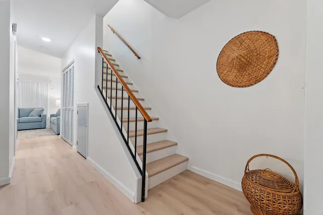 a view of an entryway with wooden floor