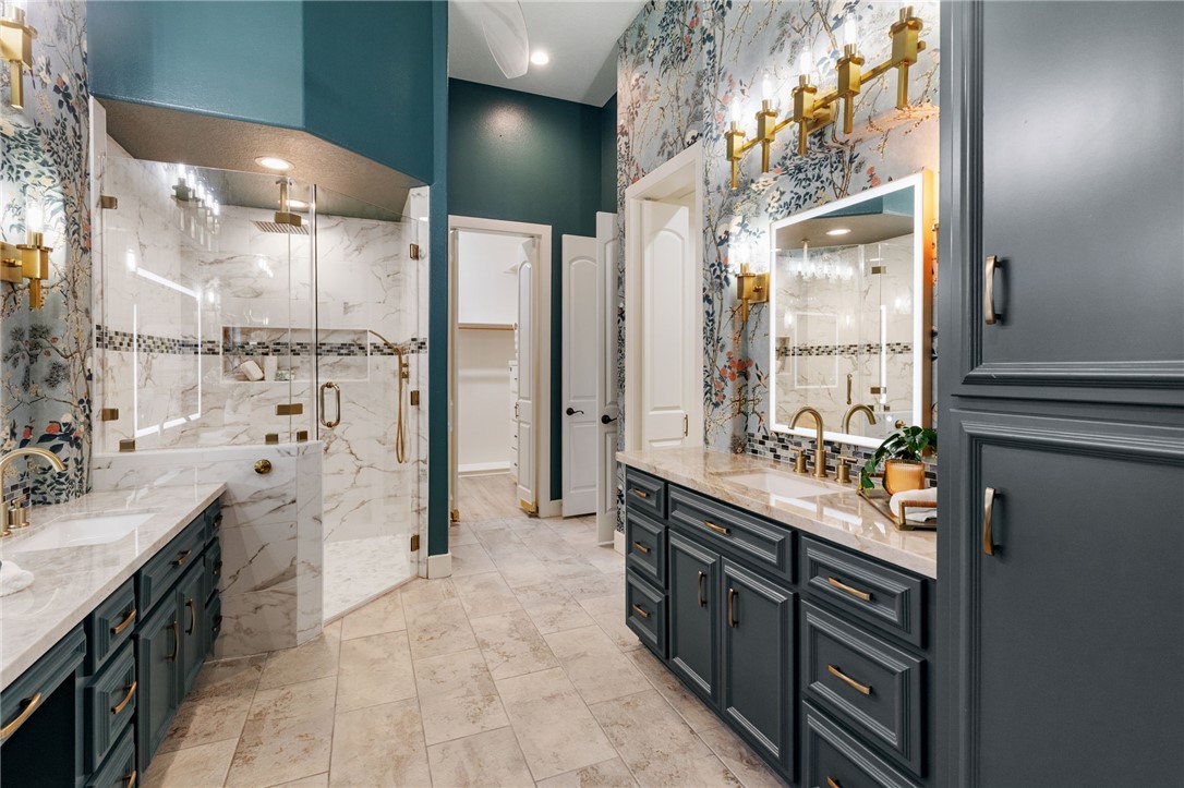 2833 Persimmon Ridge Court Bryan, TX 77807 - Photo 4 of 50 a spacious bathroom with double vanity and a shower